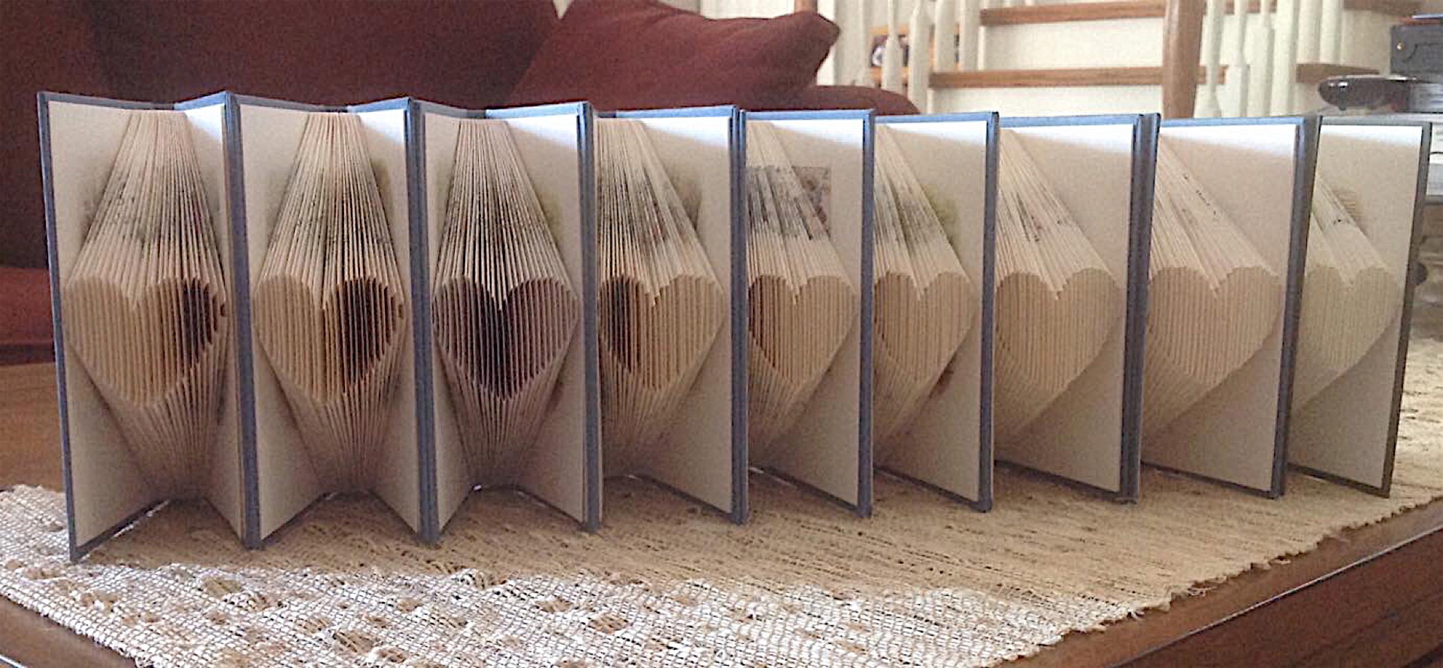 Books with pages folded into hearts