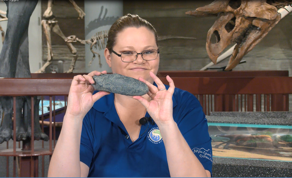 Woman holding fossil 